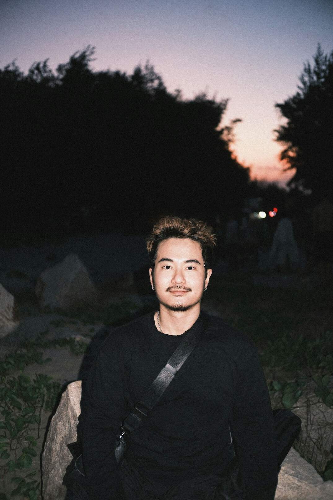 Portrait of a young man smiling outdoors