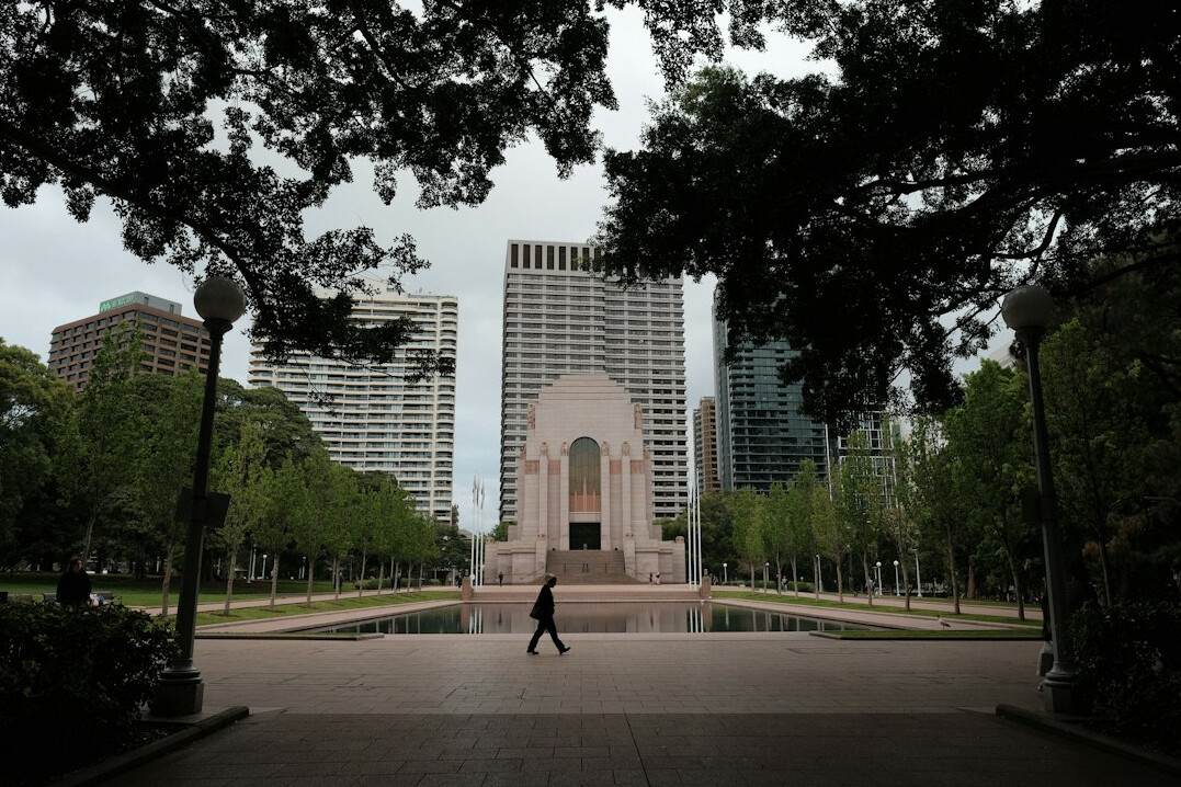 person walking in park reflecting