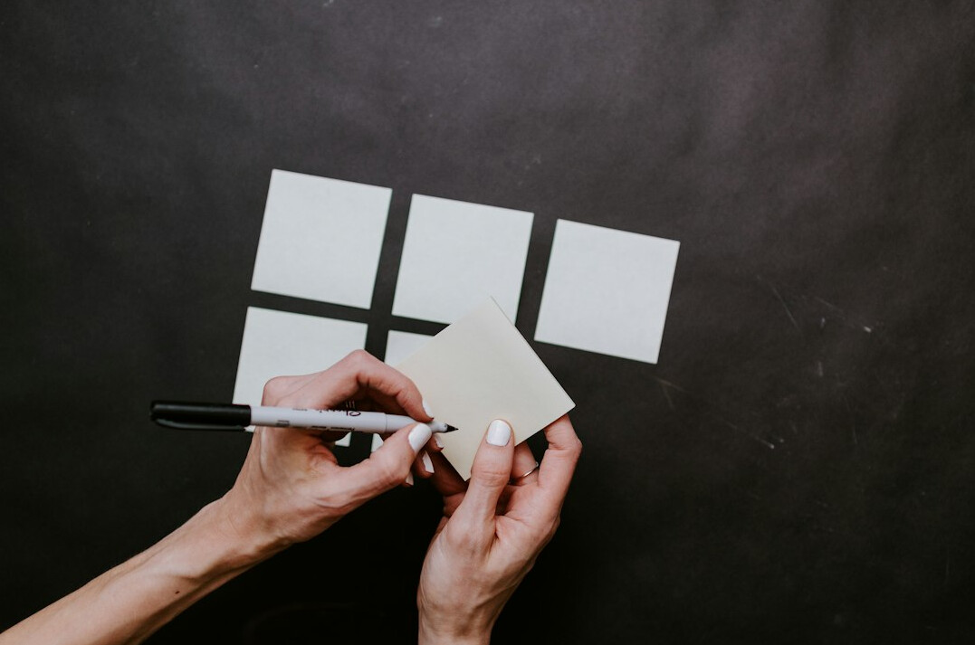 person setting goals on paper