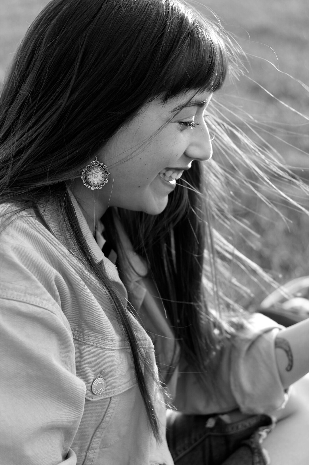 Portrait of a woman with long dark hair smiling